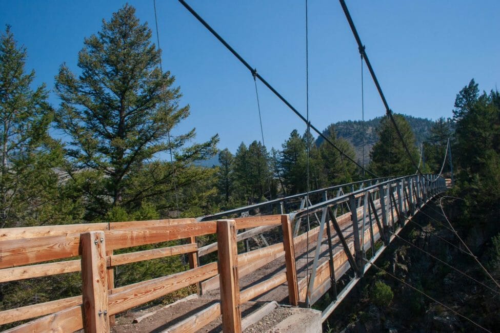 A Wooden Suspension Bridge Allows Hikers To Cross A Ravine At Hellroaring Falls in Yellowstone National Park