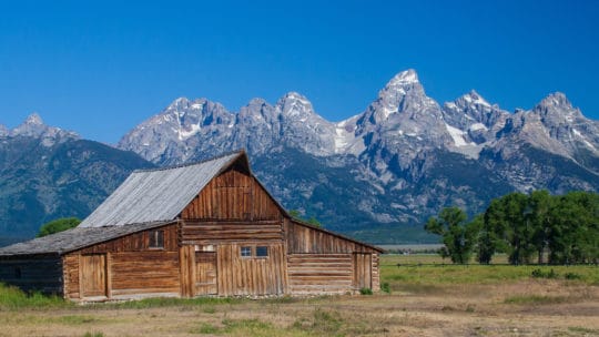 The Historic Moulton Barn Sits At The Foreground Of The Teton Range In Grand Teton National Park