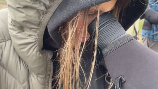 A Guest Looks Through A Spotting Scope To Watch Wildlife From Afar On A Wildlife Safari In Yellowstone National Park With Yellowstone Safari Company