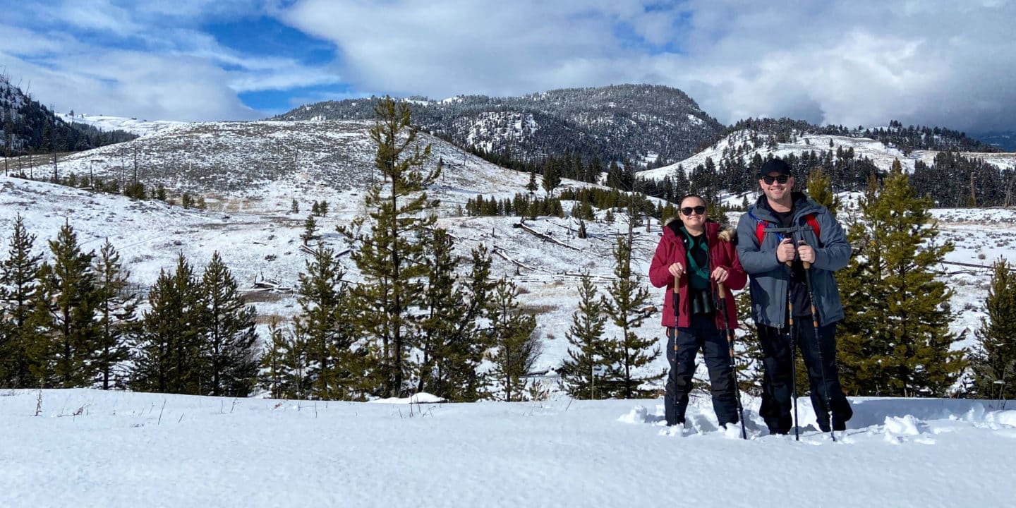 Guests Pose On Snowshoes For A Snapshot During A Big Sky Adventure Tour In Montana With Yellowstone Safari Company